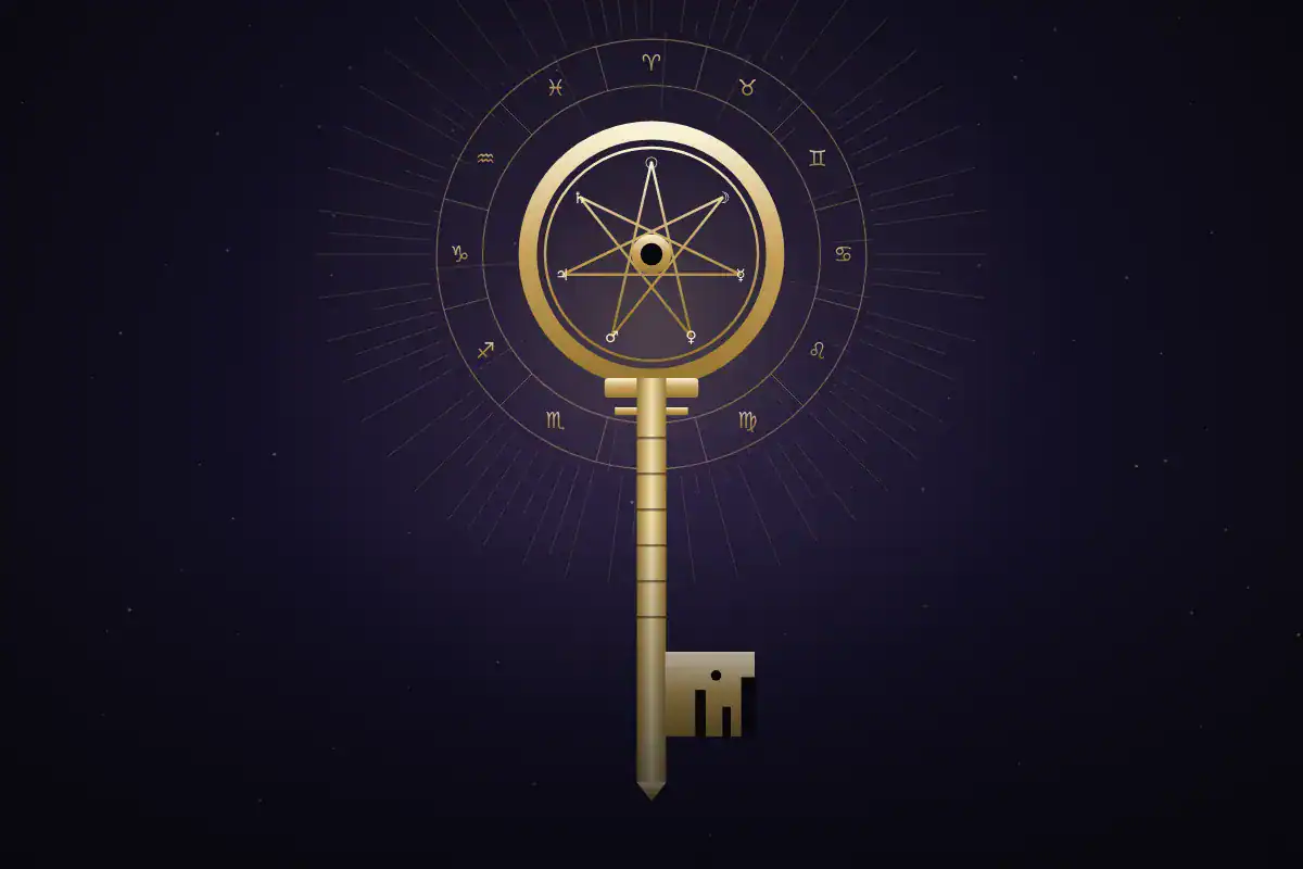 An ornate gold key with a heptagram, ringed by the zodiac